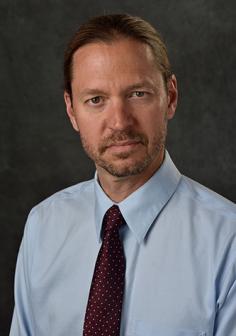 Professional headshot of Bradley Claark