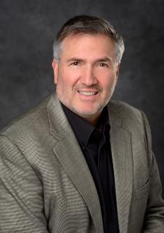 Professional headshot of Christopher Contag