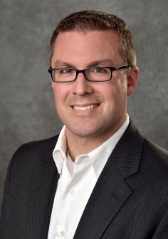 Professional headshot of Timothy Gates