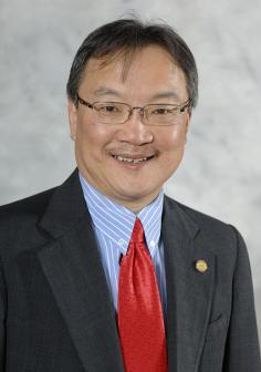 Professional headshot of Andrew Kim