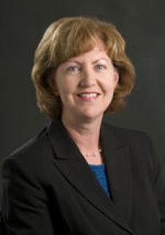 Professional headshot of Suzanne Kroll