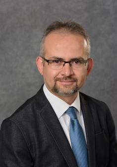 Professional headshot of Muhammed Kutay