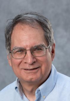 Professional headshot of Carl Lira