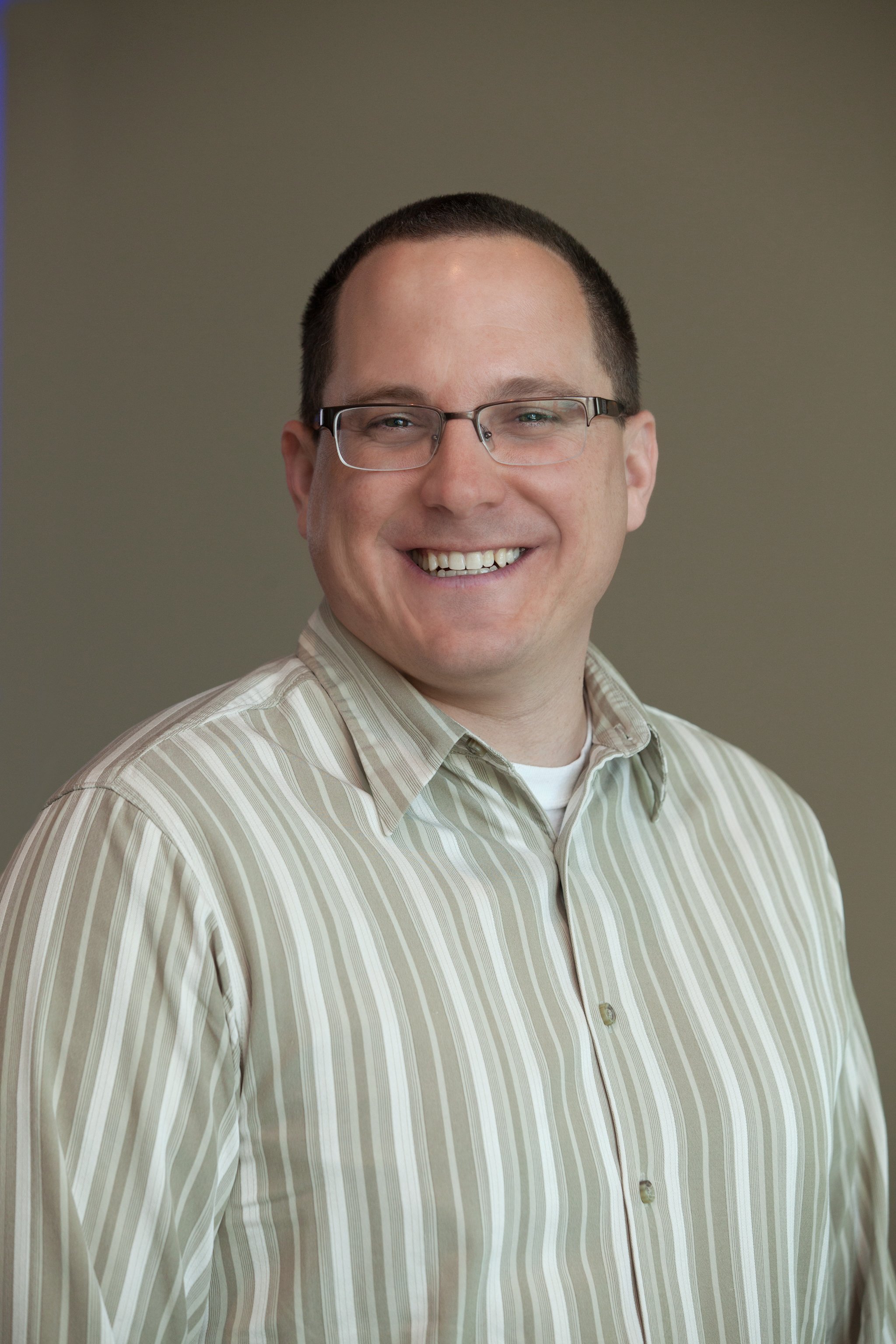 Professional headshot of Jason Nicholas