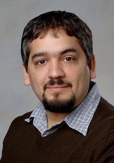 Professional headshot of Charles Ofria