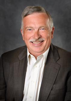 Professional headshot of  Dennis Phillips