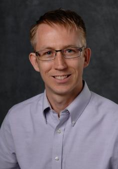 Professional headshot of Geoffrey Recktenwald