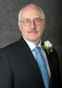 Professional headshot of William Resh