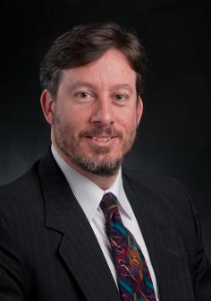 Professional headshot of John Verboncoeur