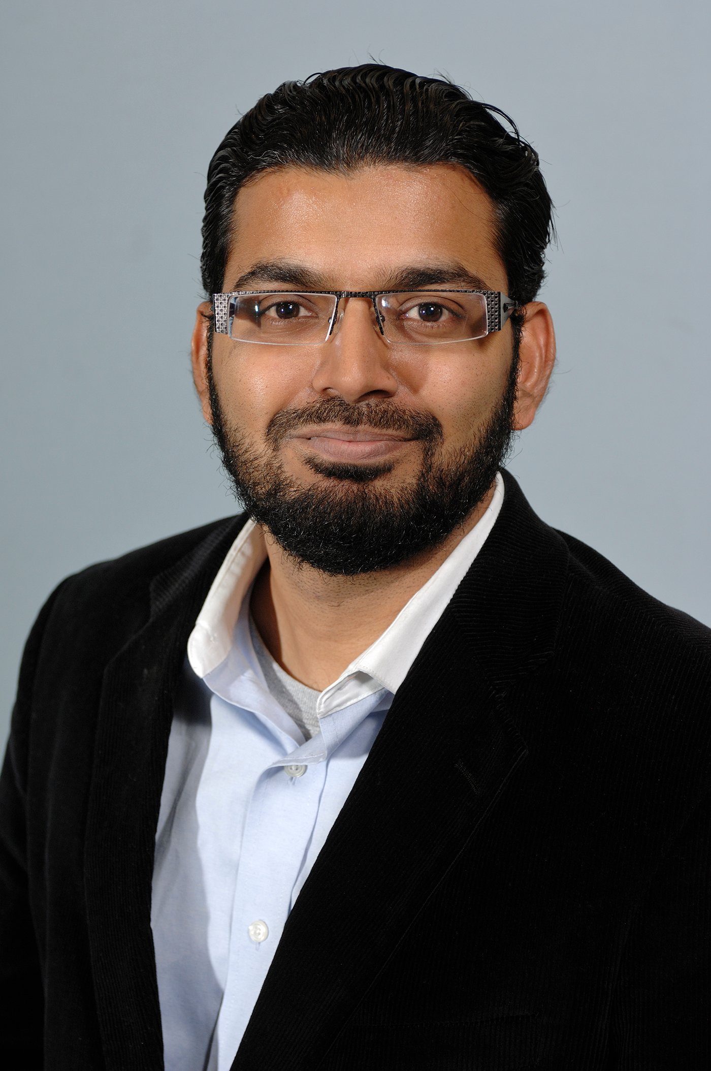 Professional headshot of Mahmoodul Haq