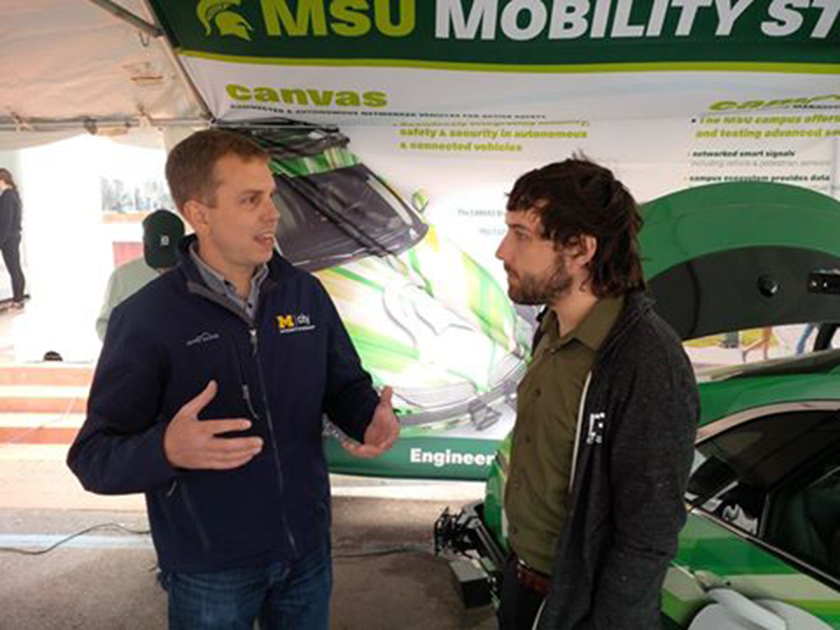 Team effort -- Greg McGuire of University of Michigan Engineering and Spartan Engineer Garrick Brazil were among those who showcased Michigan's autonomous tech at the 2017 Mackinac Policy Conference in May.