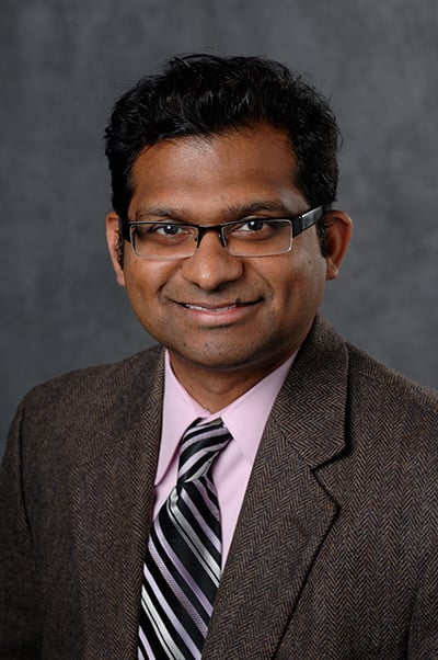 Professional headshot of Arun Ross