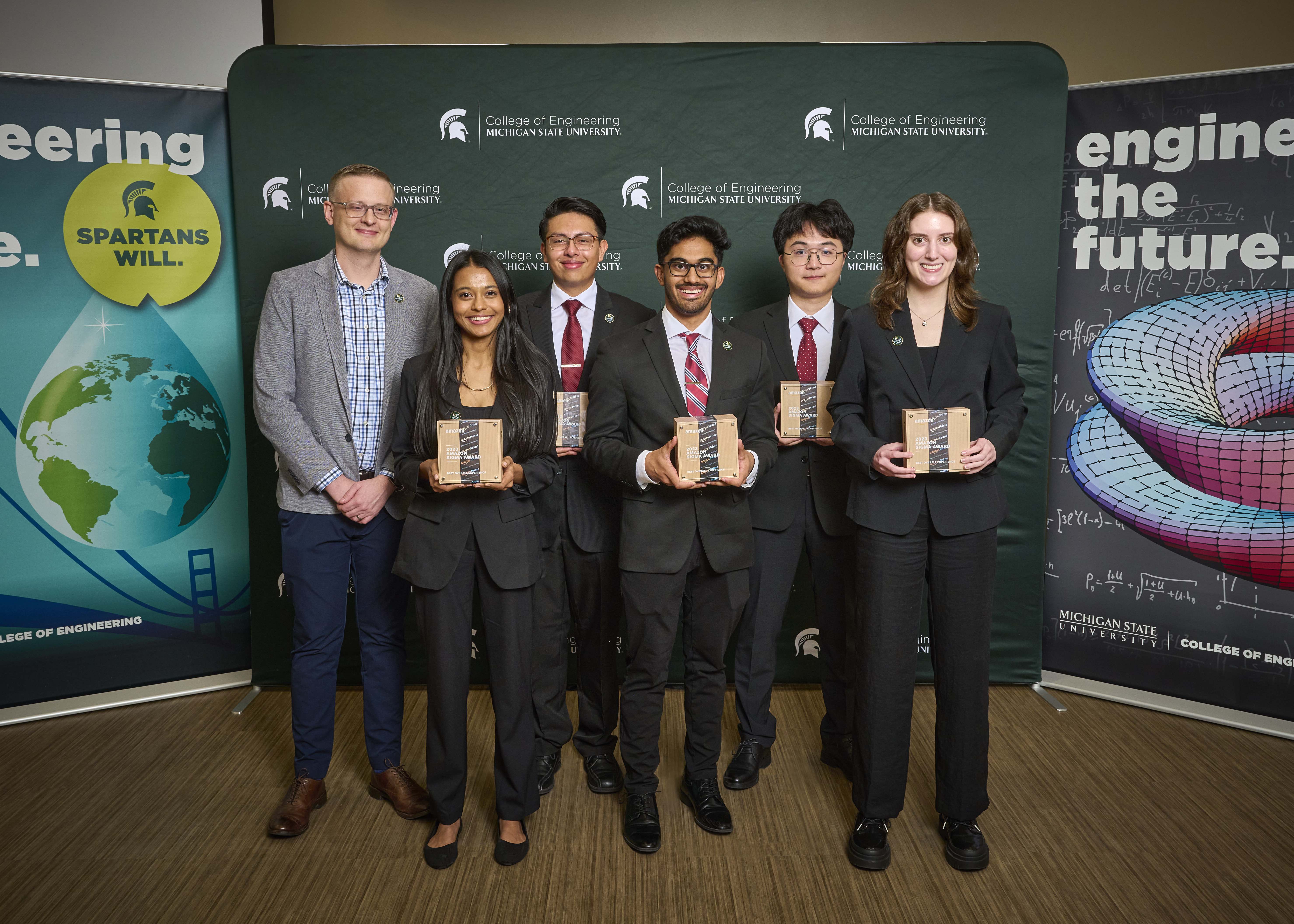 Khushi Vora, Ian Valdovinos Granados, Nathan Srivastava, Hong Zuang, Angela Majestic Non-student pictured far left: E.J. Dyksen, Amazon software development manager Project: The team created a small object detection system using closed circuit TV technology that has the ability to detect weapons automatically through a web application.
