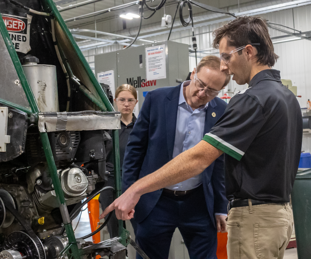 MSU Baja team chief engineer Max Fried describes vehicle improvements made to Interim Dean John Papapolymerou