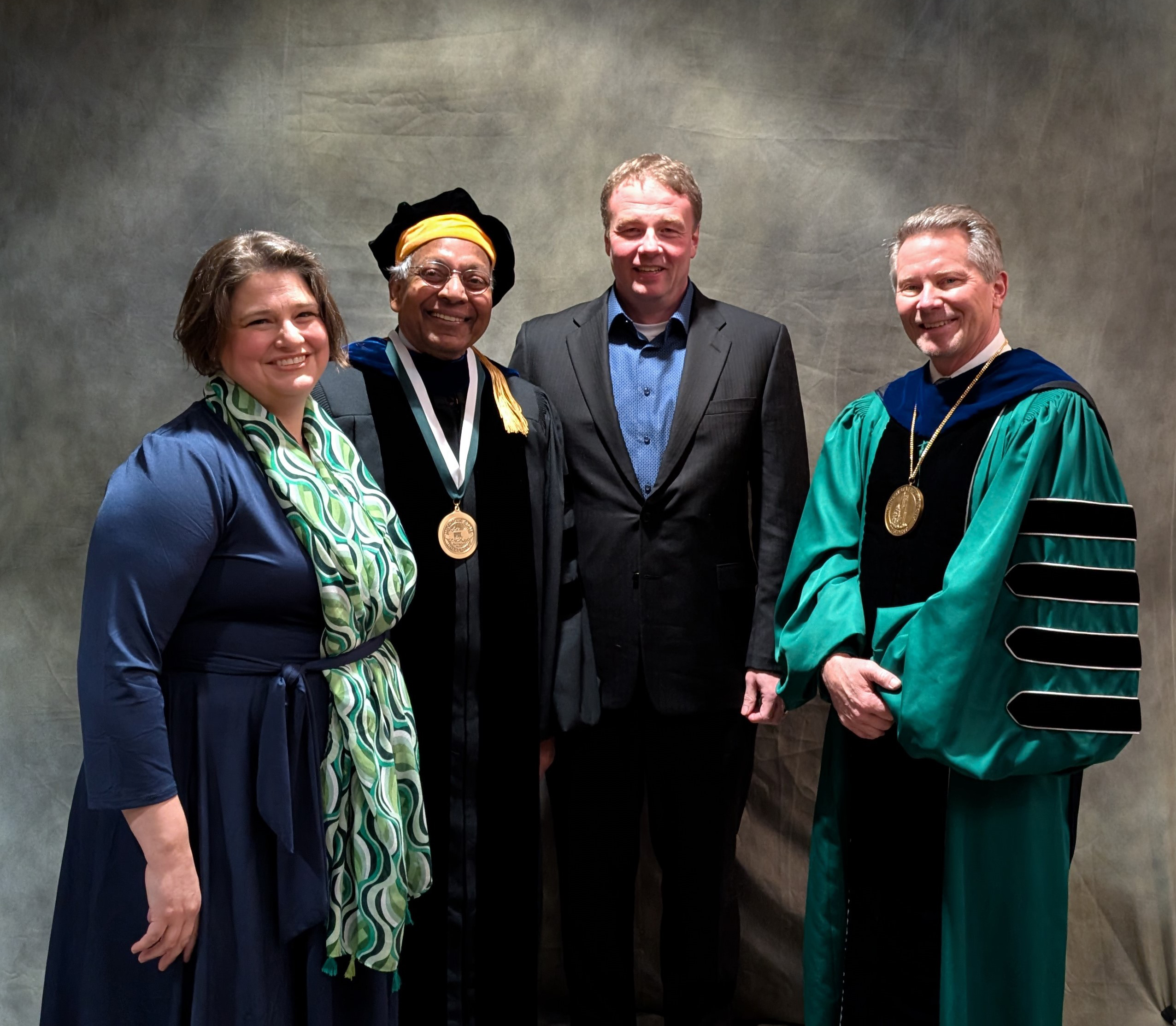 Group shot of Karen Kaufman, Anil Jain, Douglas Zongker and MSU President Kevin Guskiewicz