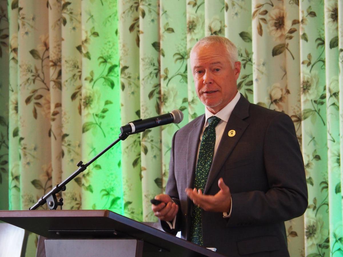 Brad Wieferich speaks at a podium