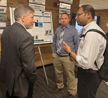 Associate Dean for Research John Verboncoeur and CSE Professor Arun Ross talk with Zachary Marshall, a STEM teacher from Waverly High School