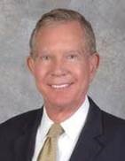 Headshot of John B. Whitledge.       