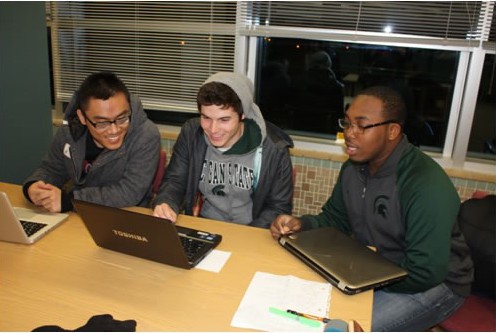 Three students studying.