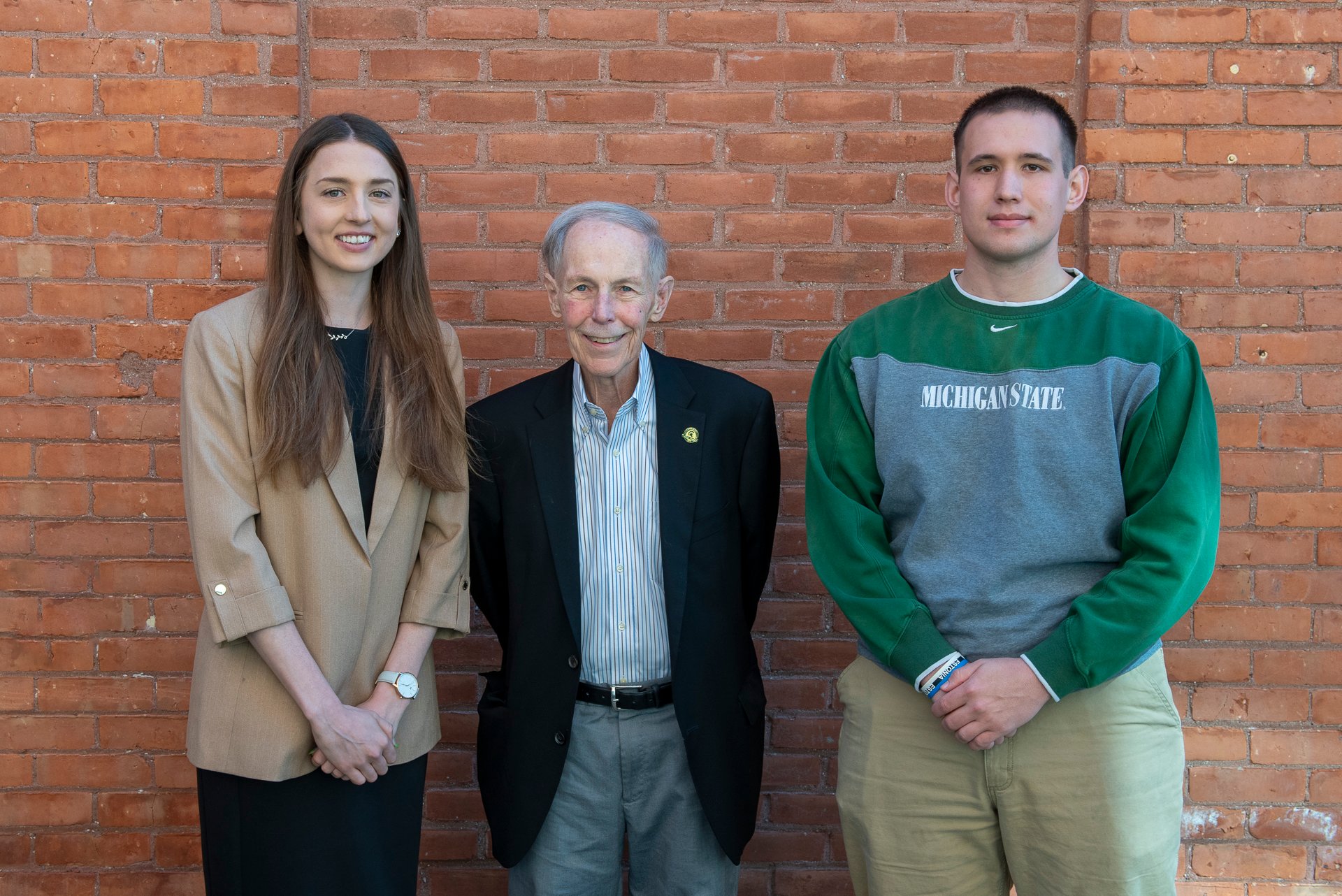 Ron Fisher smiles with undergraduate award winners.