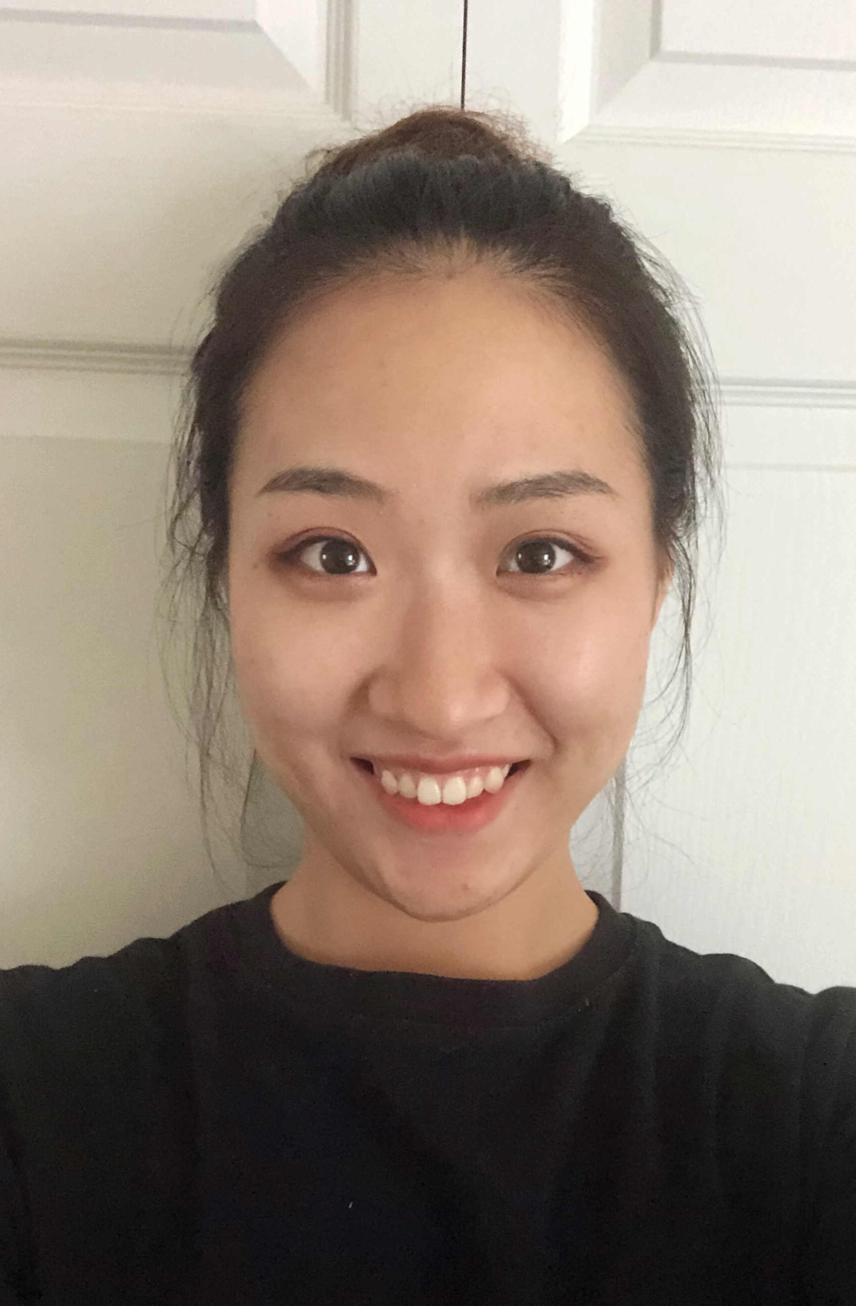 Headshot of Xueshi Wang. 
