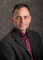 Headshot of Mark Skidmore.