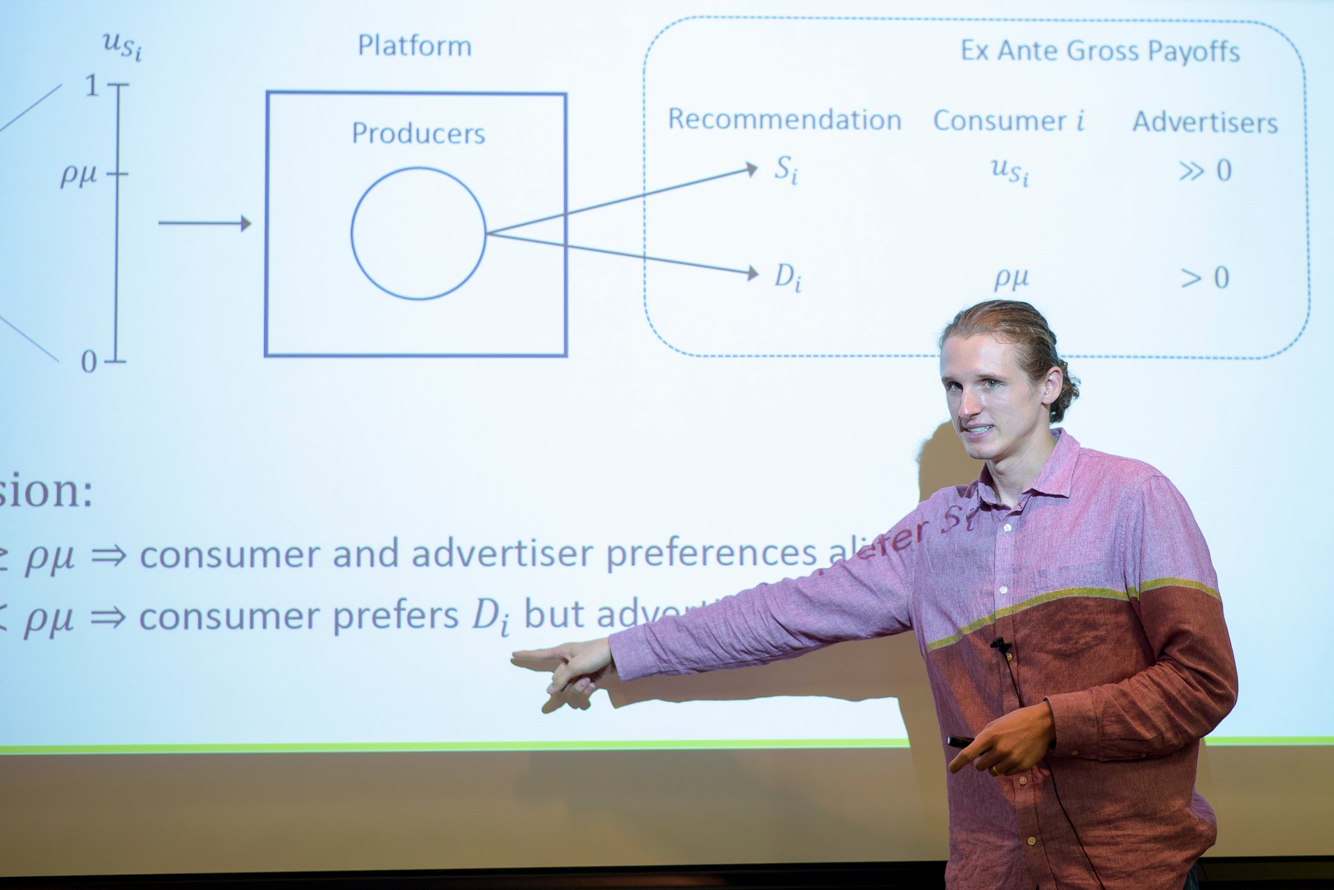 Professor points to equation. 