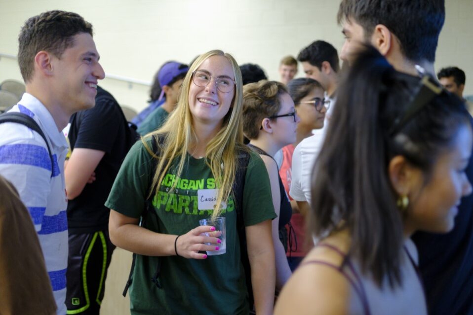 econ-undergrad-mixer-students-blondewoman-water