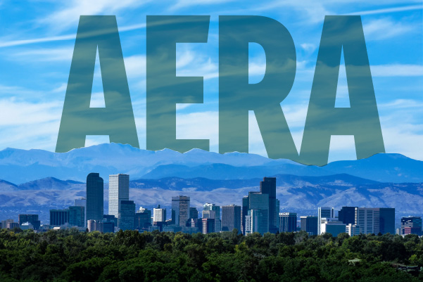 Skyline of Denver, CO with the letters AERA above the mountains.