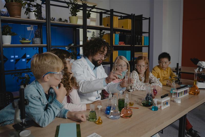science teacher demoing a science experiment 