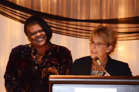 Sonya Gunnings Moton receives award from College of Education Alumni Association president Wendy Darga.