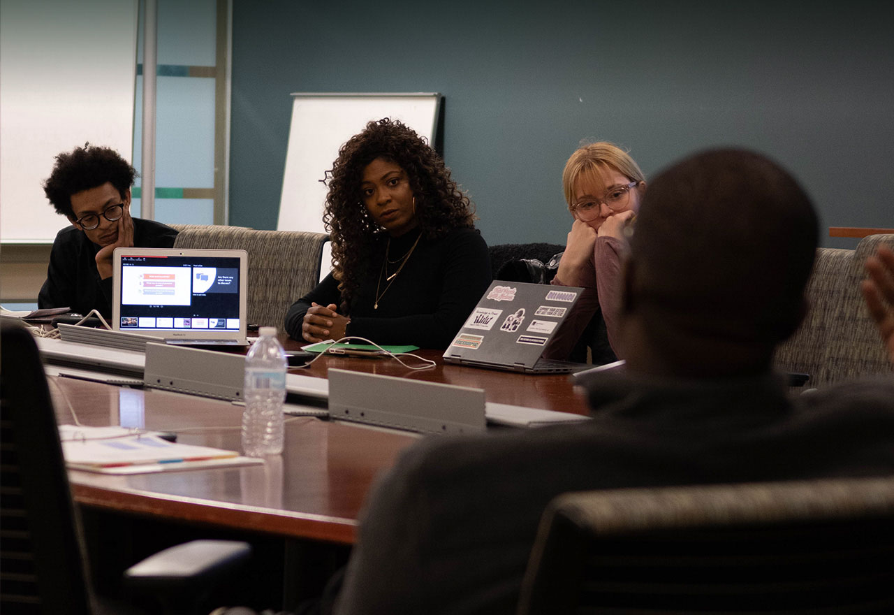Students listen to a presentation
