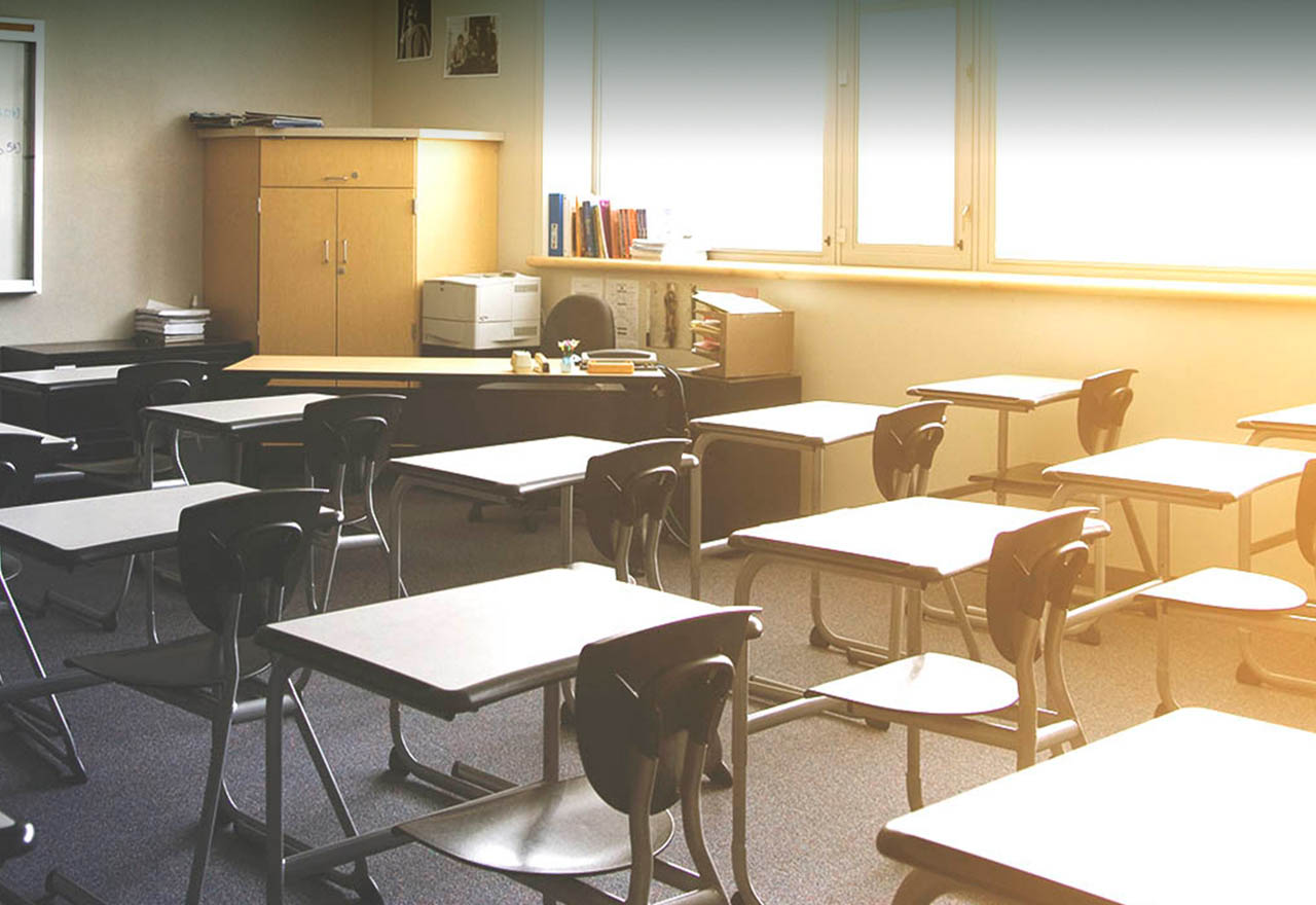 Sunlight pours into an empty classroom