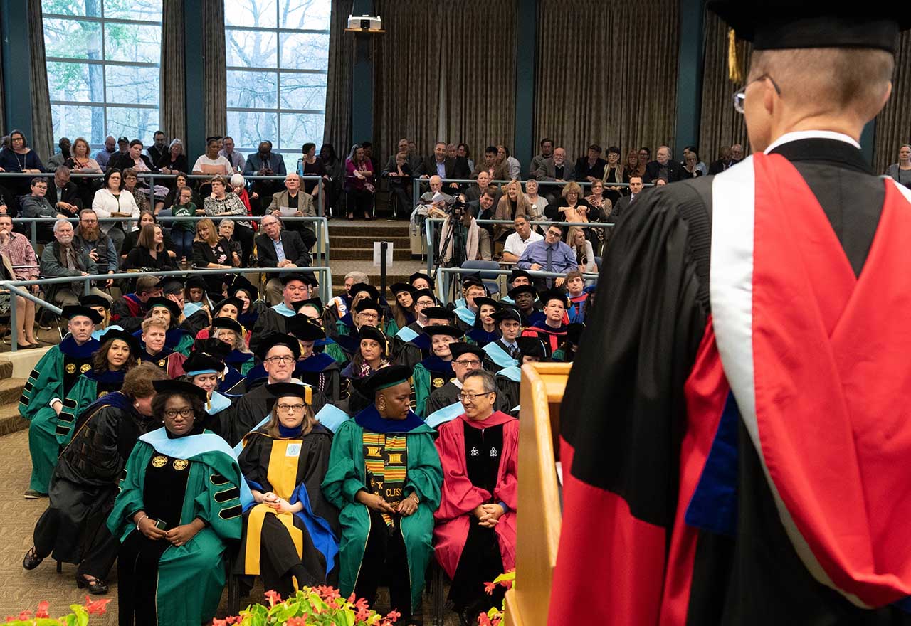 Graduates gather in a commencement ceremony