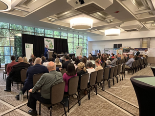 people in a conference room viewing a presentation