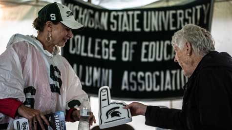 Alumni shaking hands