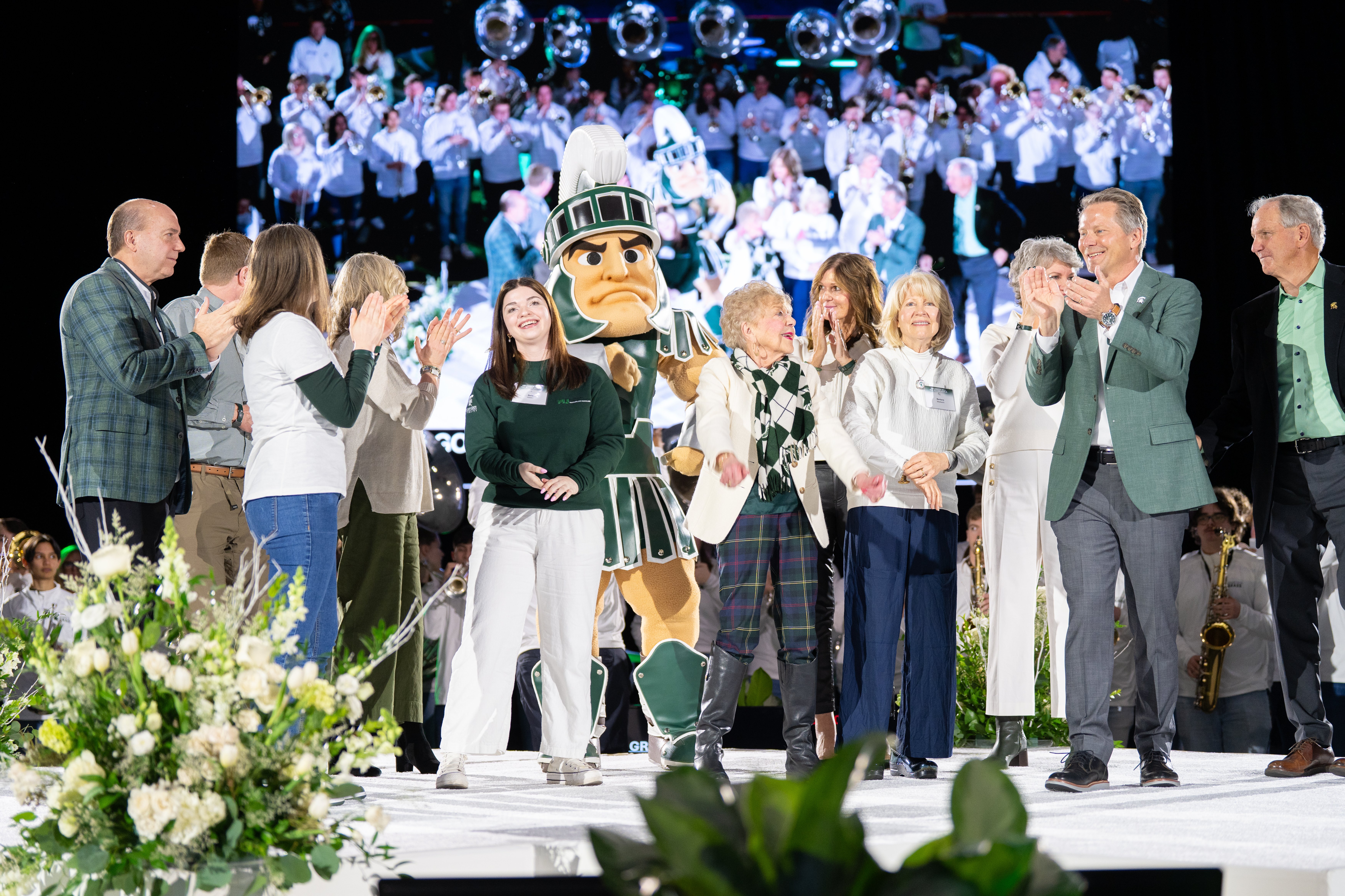 President Guskiewicz joined on stage by fellow Spartans celebrating the conclusion of the launch event.