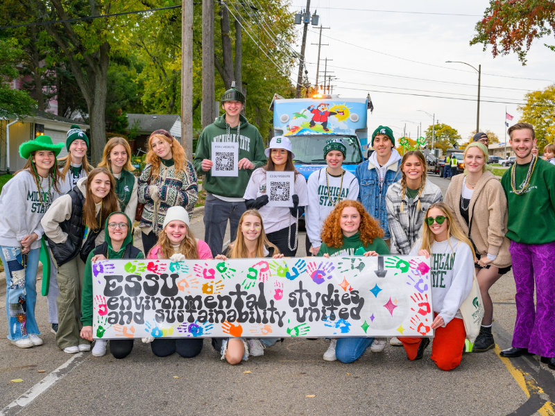 students standing behind ESSU sign