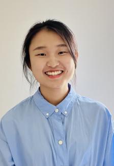 Headshot of Qi Huang.