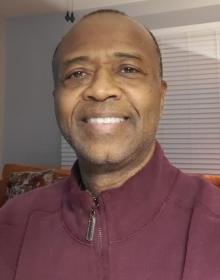 Headshot of Phillip Reid.