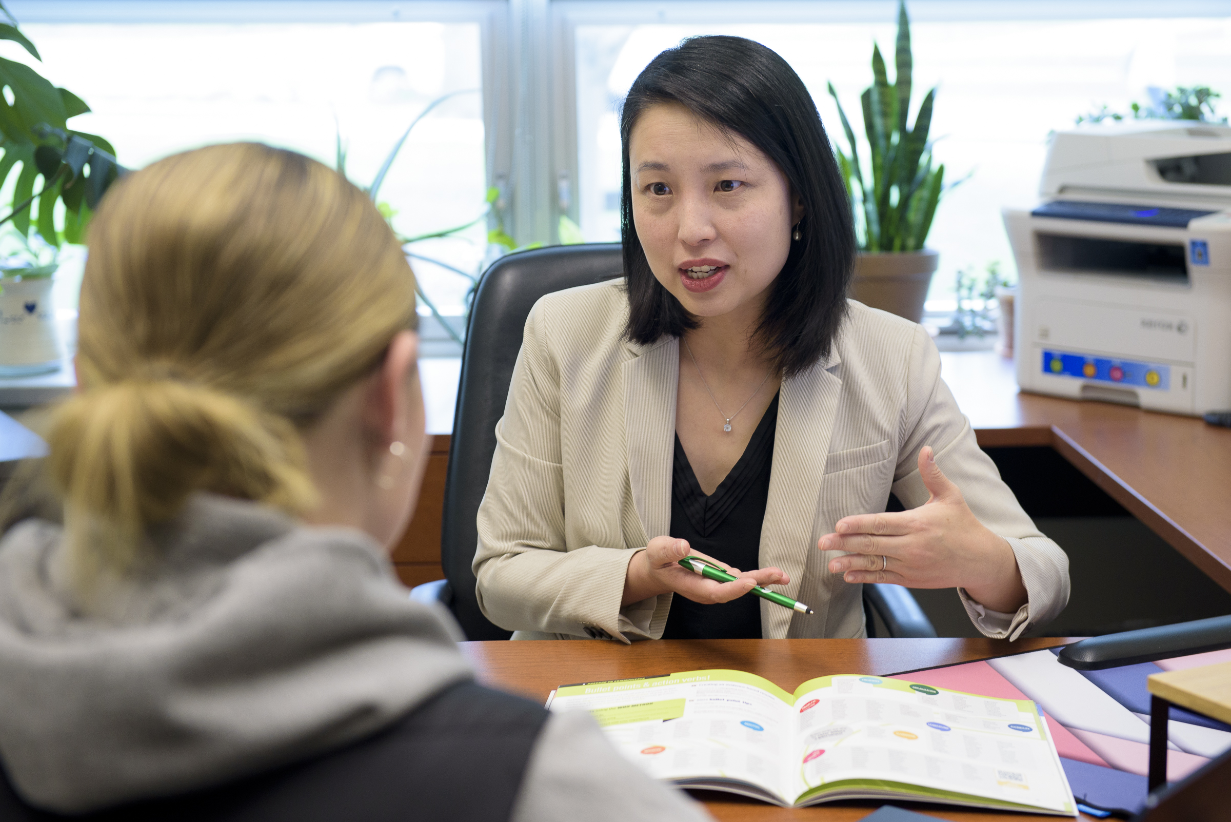 Counselor speaks with student.