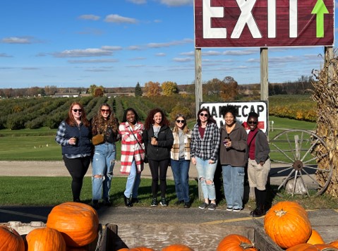 Graduate students at a pumpkin patch.