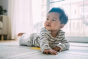 A six month old doing tummy time.