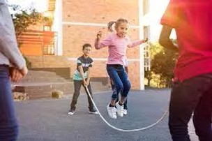 A six year old jumping rope. 