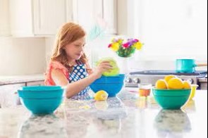 A seven year old baking.