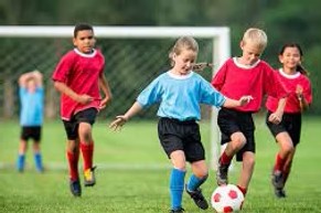 Eight year olds playing soccer.