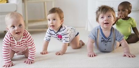 Nine month old babies crawling.