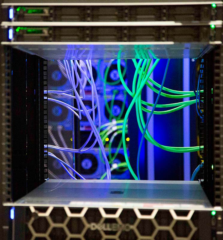 Green wires and blue lights inside the supercomputer