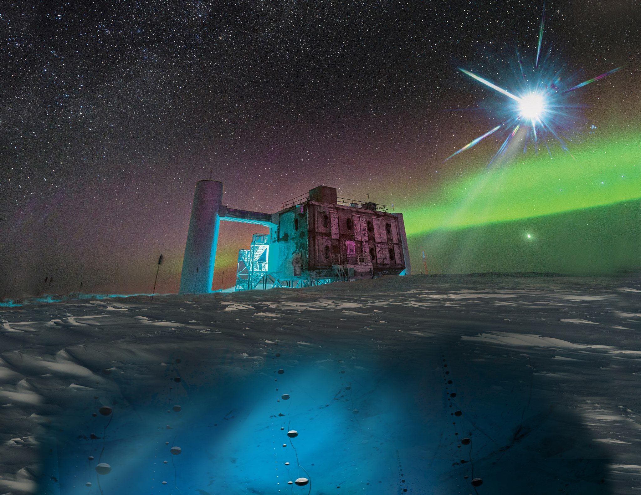In this artistic rendering, based on a real image of the IceCube Lab at the South Pole, a distant source emits neutrinos that are detected below the ice by IceCube sensors, called DOMs.