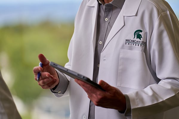doctor observing a tablet